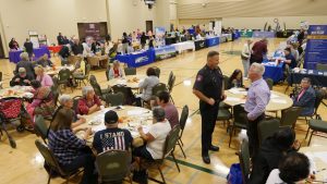 Yolo County District Attorney Jeff Reisig and Woodland Police Department Deputy Chief Derek Kaff welcoming seniors to the 11th annual senior resource and crime prevention fair.