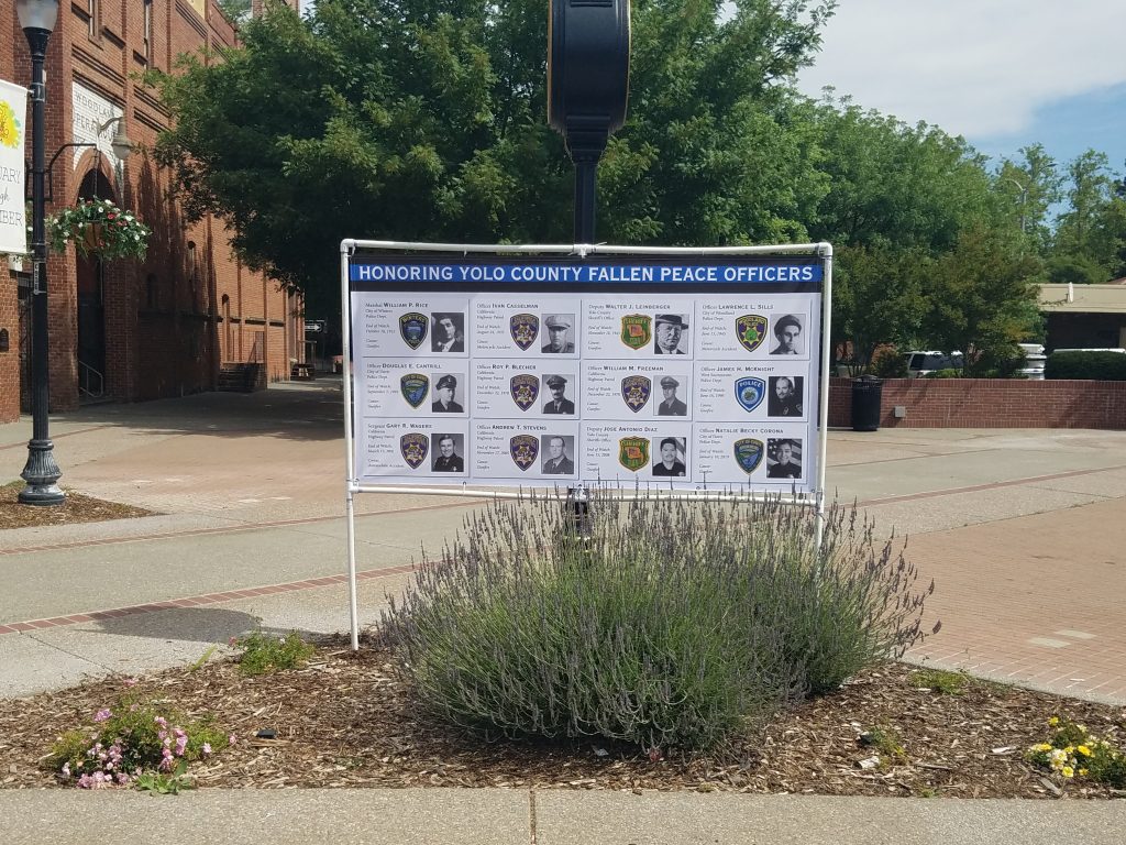 Image is a photo of the fallen peace officer memorial banner posted in Heritage Plaza, Woodland, CA.