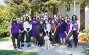 Image depicts the YCDA Victim Services Team wearing purple, the color designated to DV awareness month.