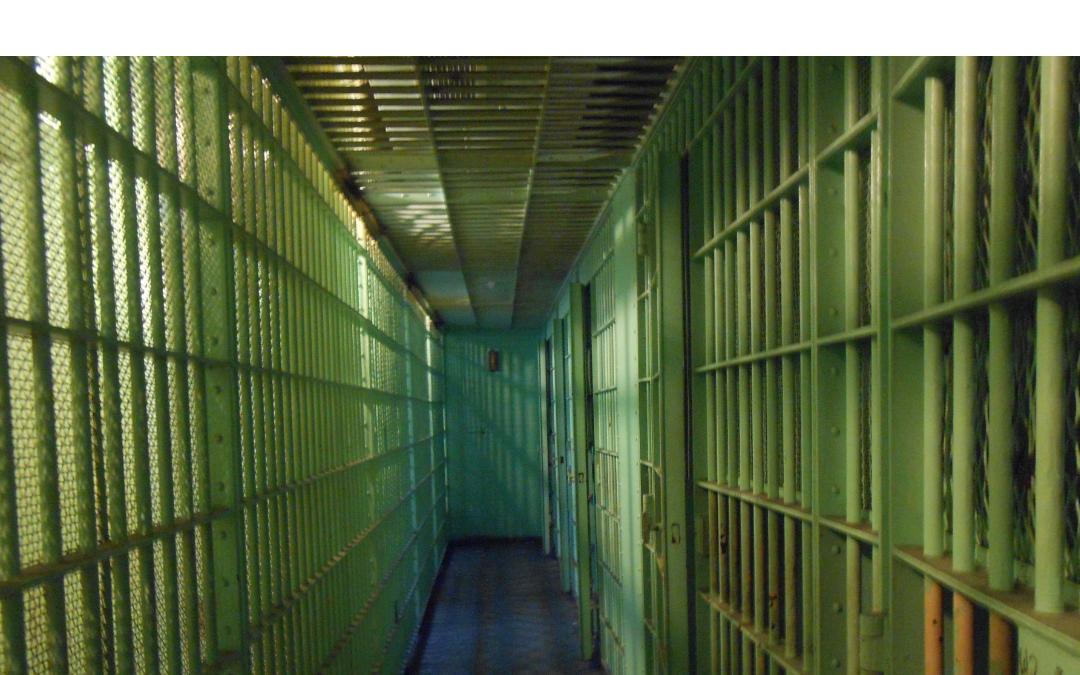 Image depicts the inside of a prison with the words: Convicted Child Molester Sentenced to Multiple Life Sentences
