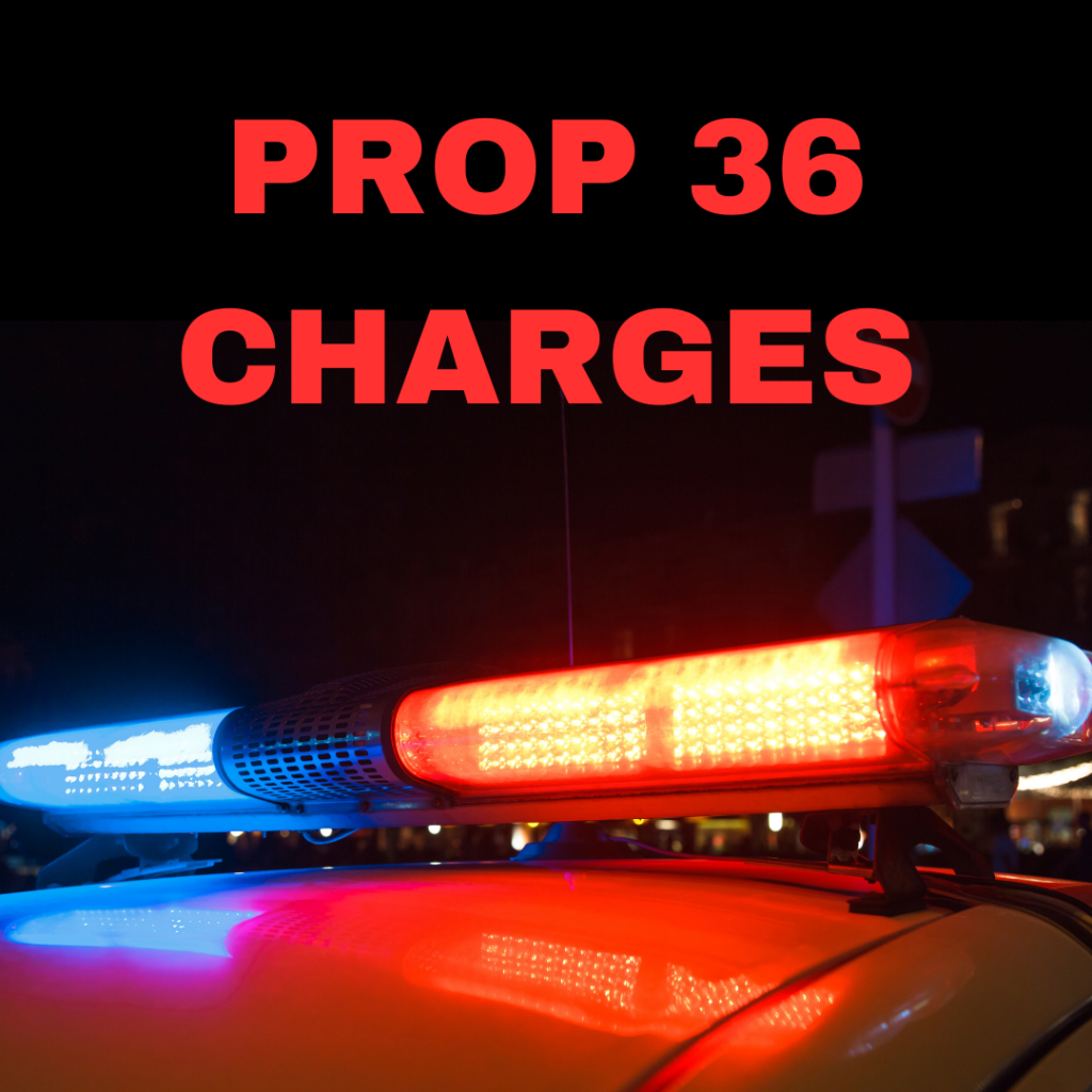 Image depicts the words Prop 36 Charges with police car lights.